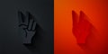 Paper cut Hand showing two finger icon isolated on black and red background. Hand gesture V sign for victory or peace Royalty Free Stock Photo