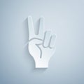 Paper cut Hand showing two finger icon isolated on grey background. Hand gesture V sign for victory or peace. Paper art Royalty Free Stock Photo