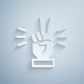 Paper cut Hand showing two finger icon isolated on grey background. Victory hand sign. Paper art style. Vector Royalty Free Stock Photo