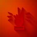 Paper cut Hand showing two finger icon isolated on red background. Victory hand sign. Paper art style. Vector Royalty Free Stock Photo