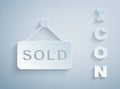 Paper cut Hanging sign with text Sold icon isolated on grey background. Auction sold. Sold signboard. Bidding concept Royalty Free Stock Photo
