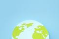 Paper-cut hemisphere of the globe with continents on a blue background. Earth day concept