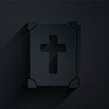 Paper cut Holy bible book icon isolated on black background. Paper art style. Vector Royalty Free Stock Photo