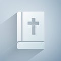 Paper cut Holy bible book icon isolated on grey background. Paper art style. Vector. Royalty Free Stock Photo