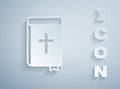 Paper cut Holy bible book icon isolated on grey background. Paper art style. Vector Royalty Free Stock Photo
