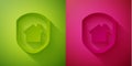 Paper cut House under protection icon isolated on green and pink background. Home and shield. Protection, safety Royalty Free Stock Photo