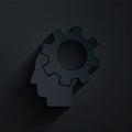 Paper cut Human head with gear inside icon isolated on black background. Artificial intelligence. Thinking brain. Symbol Royalty Free Stock Photo
