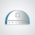 Paper cut Jewish kippah with star of david icon on grey background. Jewish yarmulke hat. Paper art style. Vector