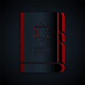 Paper cut Jewish torah book icon isolated on black background. On the cover of the Bible is the image of the Star of Royalty Free Stock Photo