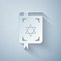 Paper cut Jewish torah book icon isolated on grey background. The Book of the Pentateuch of Moses. On the cover of the