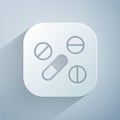 Paper cut Medicine pill or tablet icon isolated on grey background. Capsule pill and drug sign. Pharmacy design. Paper Royalty Free Stock Photo