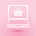 Paper cut Mobile phone and shopping basket icon isolated on pink background. Online buying symbol. Supermarket basket Royalty Free Stock Photo