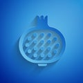 Paper cut Pomegranate icon isolated on blue background. Garnet fruit. Paper art style. Vector