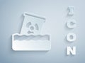 Paper cut Radioactive waste in barrel icon isolated on grey background. Toxic waste contamination on water Royalty Free Stock Photo