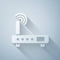 Paper cut Router and wi-fi signal icon isolated on grey background. Wireless ethernet modem router. Computer technology