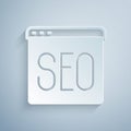 Paper cut SEO optimization icon isolated on grey background. Paper art style. Vector