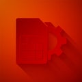 Paper cut Sim card setting icon isolated on red background. Mobile cellular phone sim card chip. Mobile Royalty Free Stock Photo