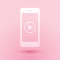Paper cut Smartphone with play button on the screen icon isolated on pink background. Paper art style. Vector Royalty Free Stock Photo