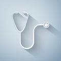 Paper cut Stethoscope medical instrument icon isolated on grey background. Paper art style