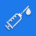 Paper cut Syringe icon isolated on blue background. Syringe for vaccine, vaccination, injection, flu shot. Medical Royalty Free Stock Photo