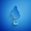 Paper cut Tree icon isolated on blue background. Forest symbol. Paper art style. Vector Royalty Free Stock Photo