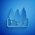 Paper cut Trees icon isolated on blue background. Forest symbol. Paper art style. Vector Royalty Free Stock Photo