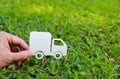 Paper cut of truck on green grass background