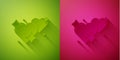 Paper cut Two Linked Hearts icon isolated on green and pink background. Romantic symbol linked, join, passion and Royalty Free Stock Photo