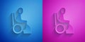 Paper cut Woman in wheelchair for disabled person icon isolated on blue and purple background. Paper art style. Vector Royalty Free Stock Photo