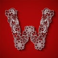 Paper cutting, white letter W . Red background. Floral ornament, balinese traditional style.