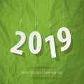 Paper 2019 digits white on a crumpled paper green background.