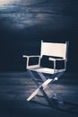 Paper director chair on a blueish grey background