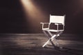 Paper director chair on a blueish grey background Royalty Free Stock Photo