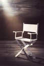 Paper director chair on a blueish grey background