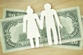 Paper elderly couple cut-out on dollar banknotes - Pension concept