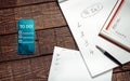 Paper And Electronic To Do Lists On Wooden Surface, Top View. Memo Planning Technology Concept