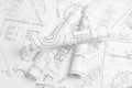 Paper engineering drawings of industrial parts and mechanisms