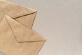 Paper envelopes on brown background with copy space