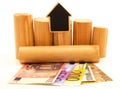 Paper euro money and wooden logs