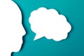 Paper face and speech bubble on colorbackground copy space for text, communication, symbolic- Image Royalty Free Stock Photo