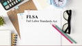 Paper with Fair Labor Standarts Act FLSA