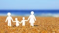 Paper Family on the beach. Family
