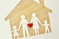 Paper family cut-out and house - Love and family union concept Royalty Free Stock Photo