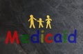 Paper family with Medicaid text Royalty Free Stock Photo