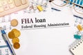Paper with FHA loan - Federal Housing Administration on a table
