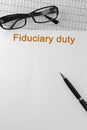 Paper with Fiduciary duty on a table