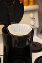 Paper filter in a coffee pot Royalty Free Stock Photo