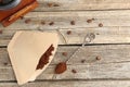 Paper filter, ground coffee, beans and grinder on wooden table, flat lay. Space for text Royalty Free Stock Photo