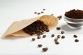 Paper filter, ground coffee and beans on white wooden table Royalty Free Stock Photo