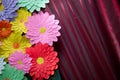 Paper flower. Glade of multi-colored flowers. Red curtain background . Valentine`s Day. Flowers of paper craft colorful backgroun Royalty Free Stock Photo